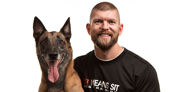 Chris Altherr and a dog smiling at the camera